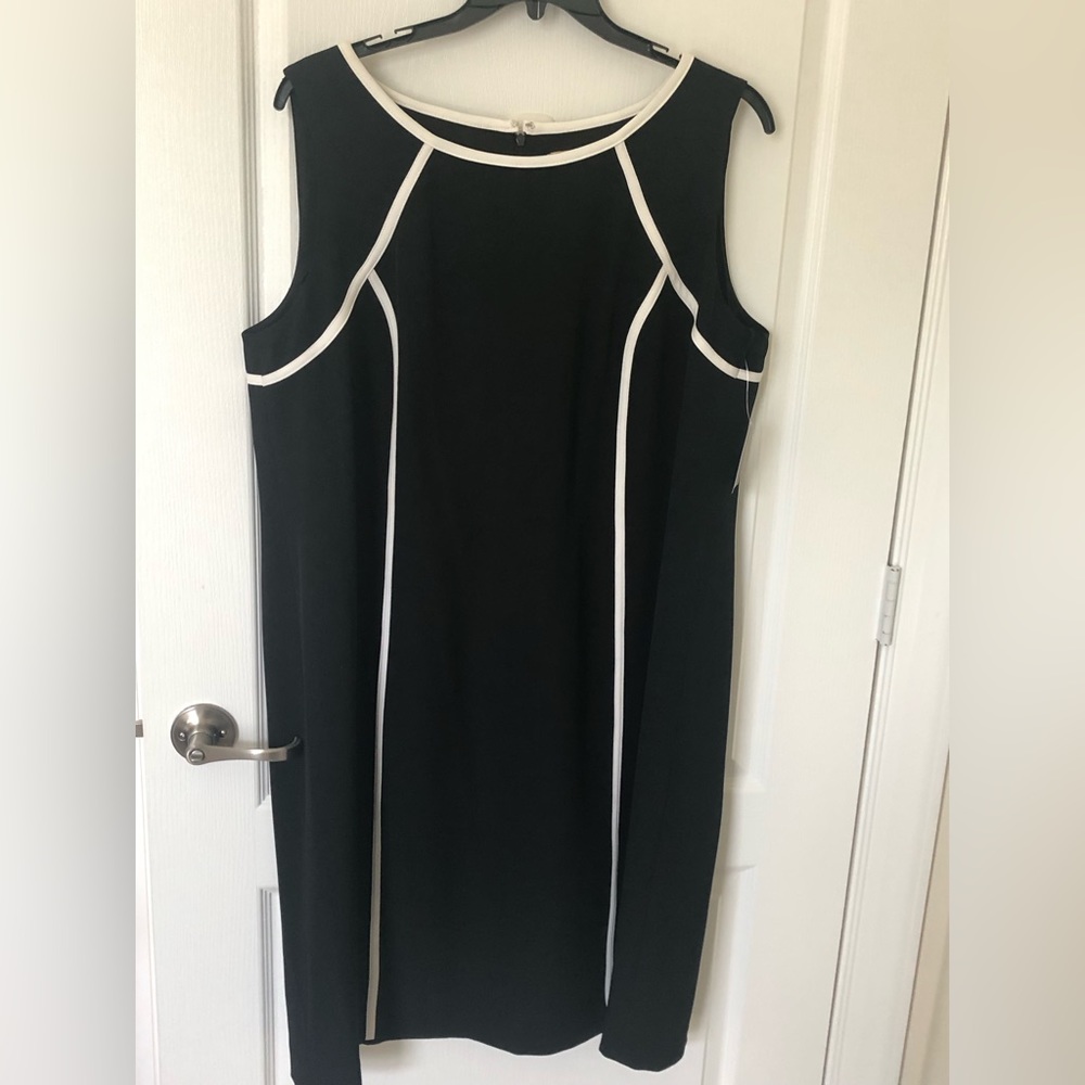 Black and white dress. Knee length. Good for business or play.